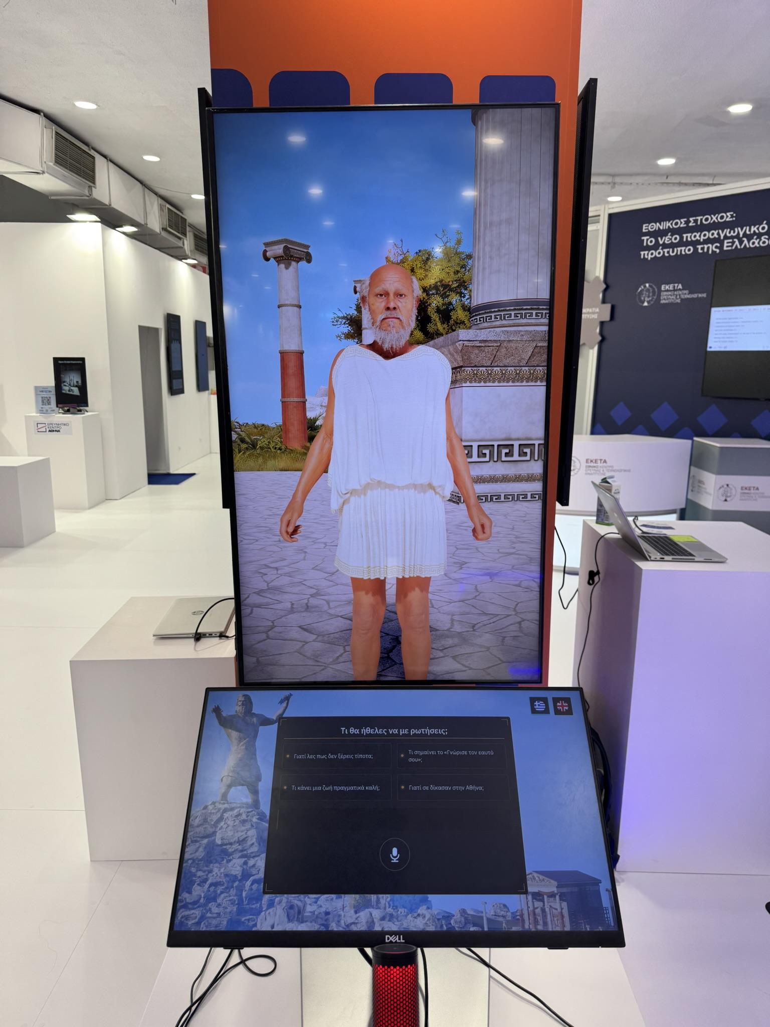 Socrates avatar on a portrait display with a touch screen control panel at the Thessaloniki International Fair