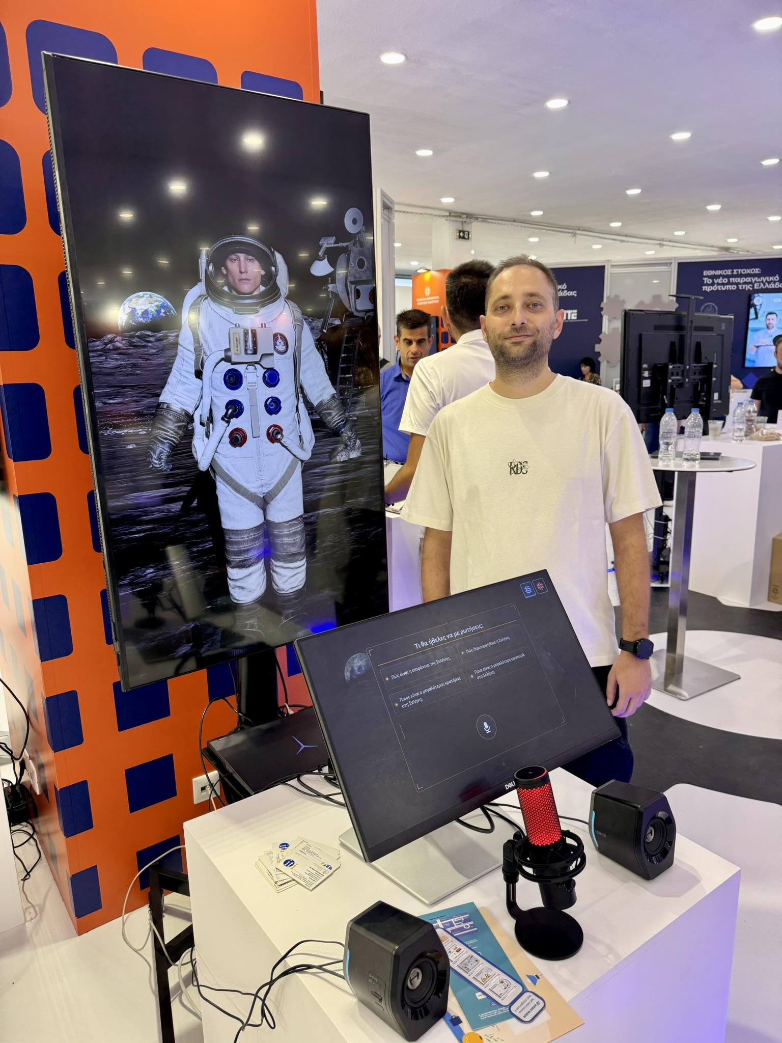Astronaut avatar on a large screen beside its touch control panel at the Thessaloniki International Fair